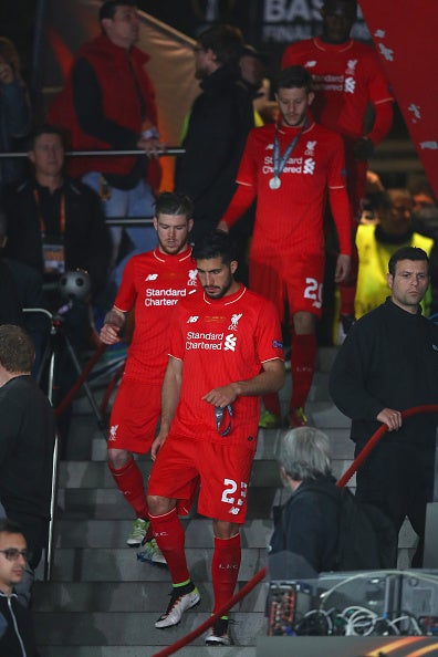 Emre Can leads the Liverpool players down the steps after the beaten side received their runners-up medals (Getty)