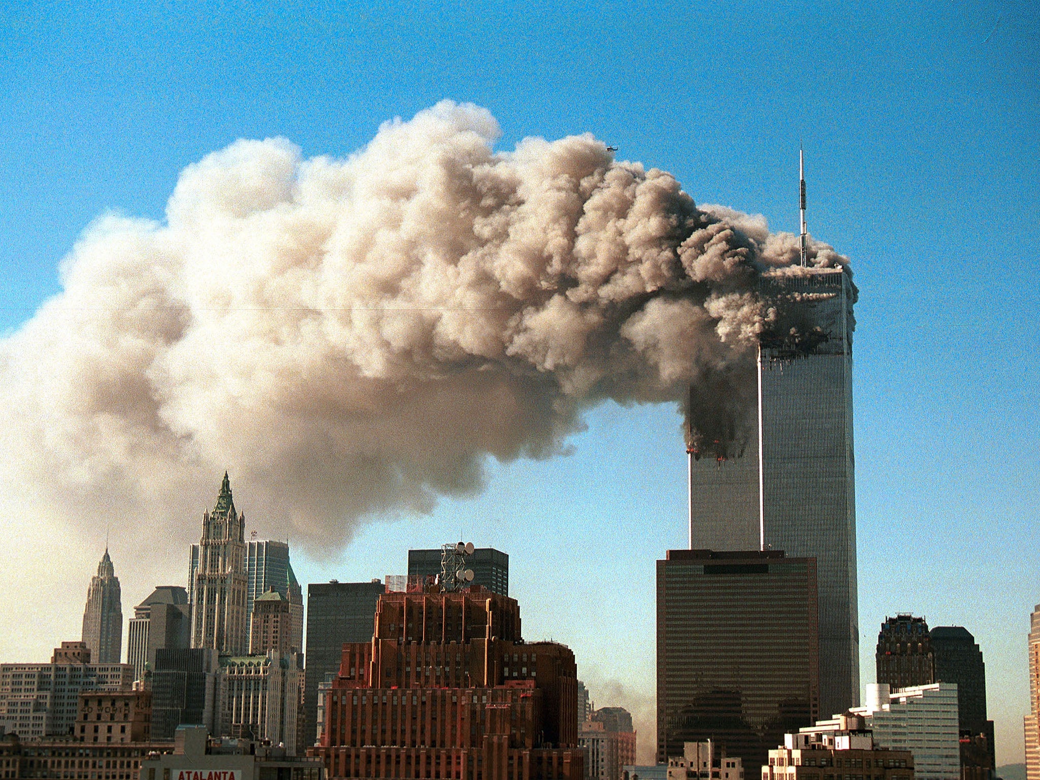 "All I could see in the distance was a cloud pushing itself above buildings and towards a cloudless sky"