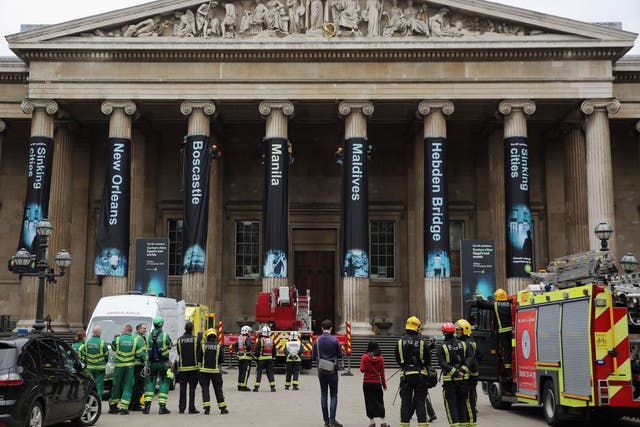 Greenpeace activists hang banners on the front of the British Museum