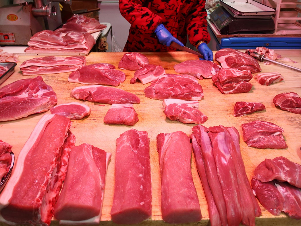 A butcher chops up meat in China (file pic)