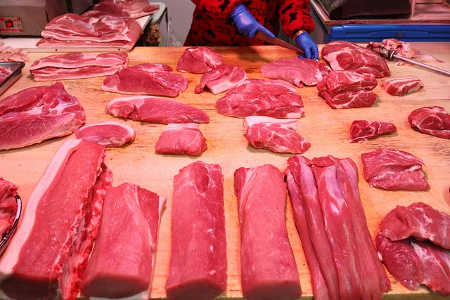 A butcher chops up meat in China (file pic)