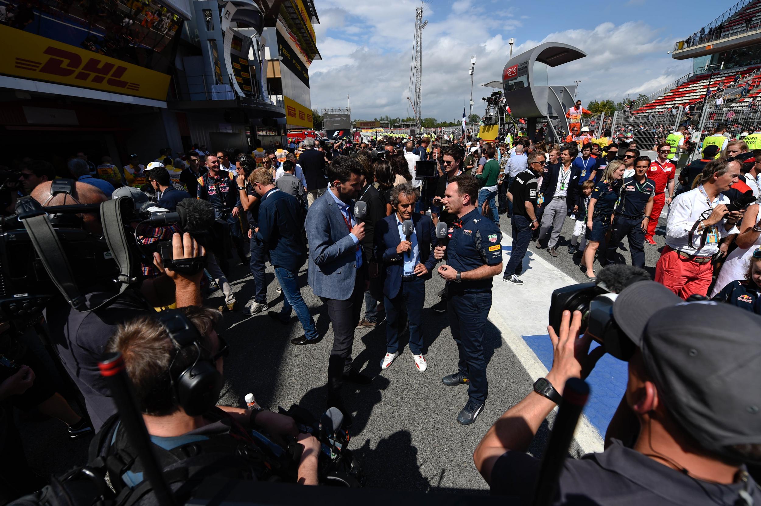 Steve Jones and Alain Prost speak with Red Bull team principal Christian Horner after Max Verstappen's victory
