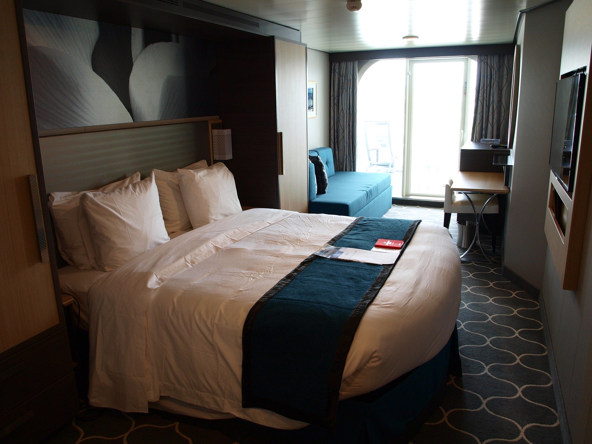 A stateroom with a balcony