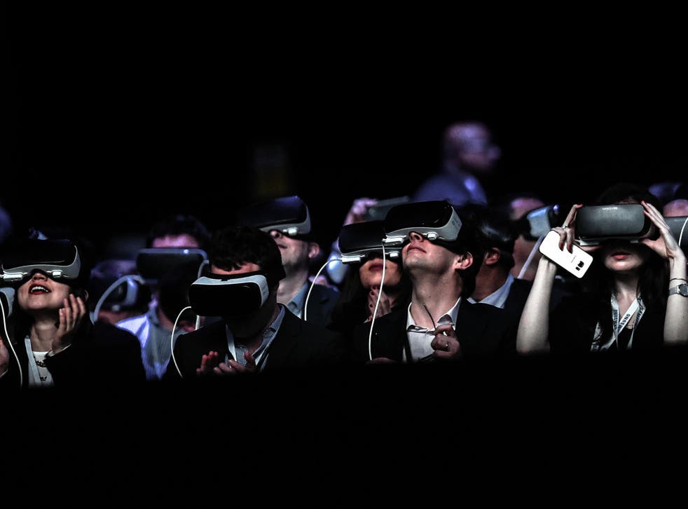 Attendees at the launch of the Samsung Galaxy S7 smartphone use VR headsets