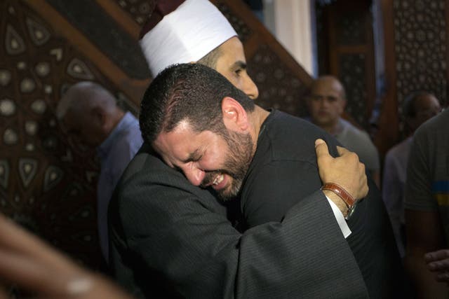 Relatives unable to hold funerals for their loved ones said prayers at mosques in Cairo