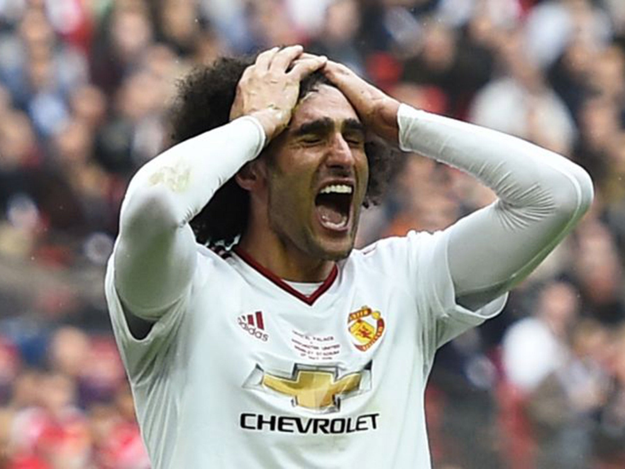 Marouane Felaini reacts to missing a chance at goal in the FA Cup final