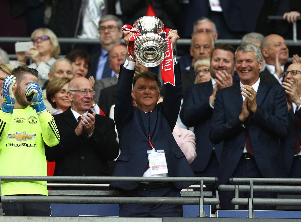 Louis van Gaal lifts the FA Cup trophy after Manchester United's 2-1 win over Crystal Palace
