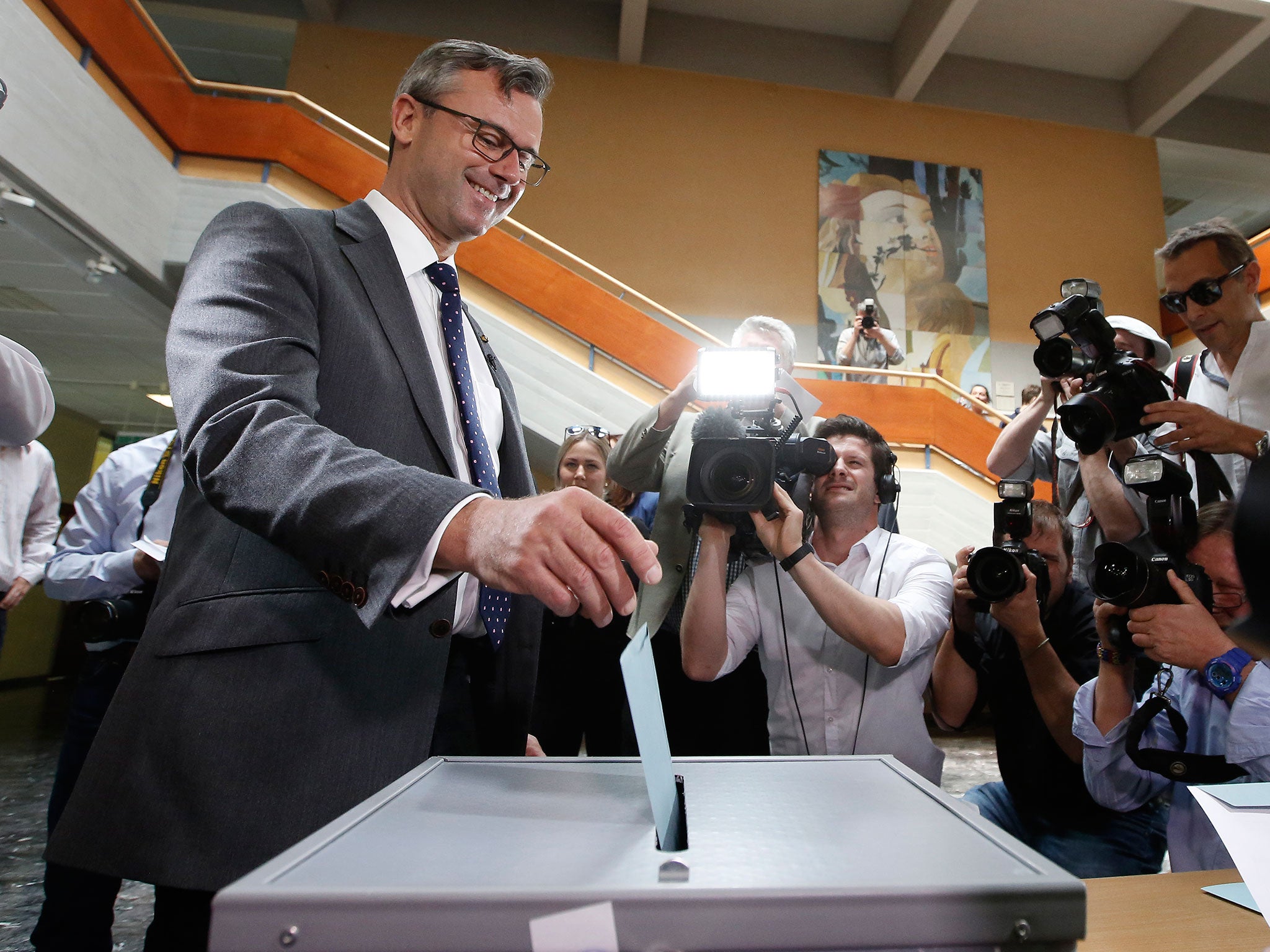 Austrian Freedom Party candidate Norbert Hofer drops his ballot during the second round of Austrian President elections