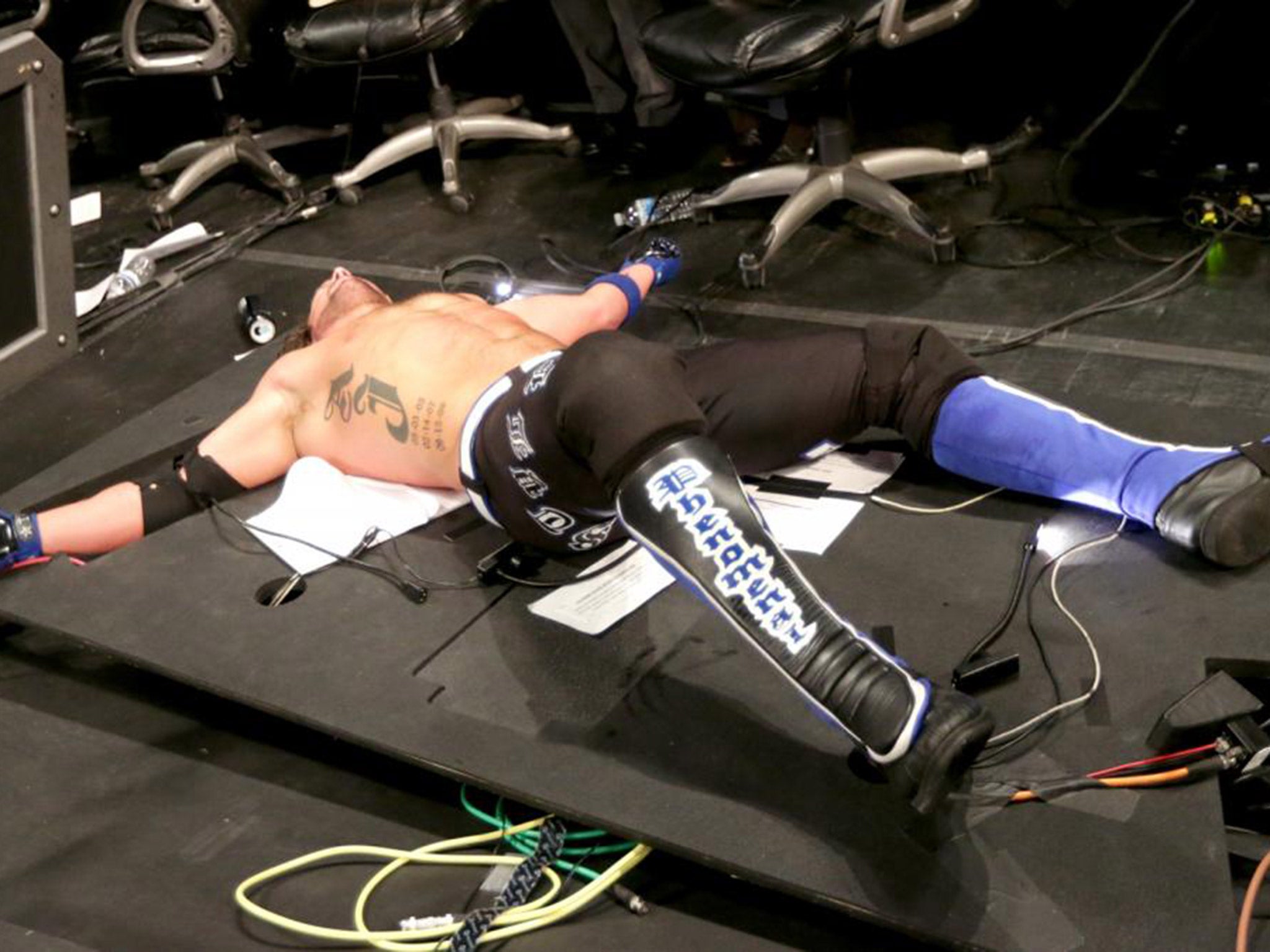 AJ Styles was back-dropped through the announcers' table