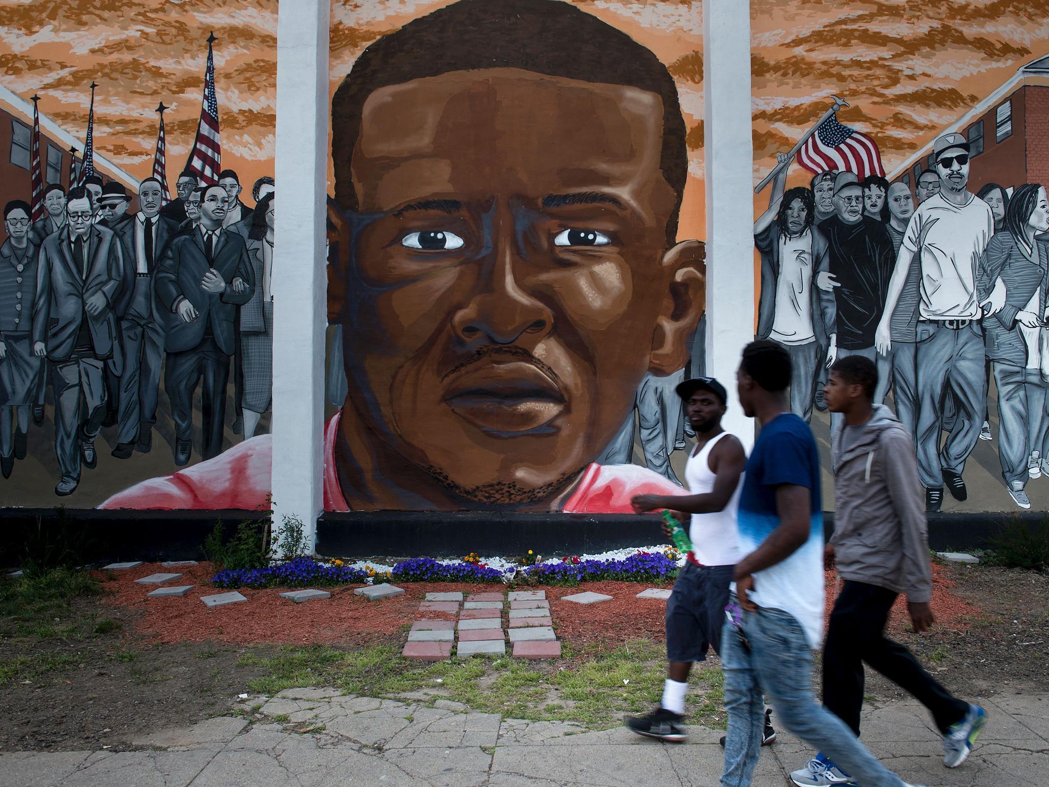 A mural depicting Freddie Gray in the Baltimore neighbourhood where he lived Brendon Smialowski/Getty