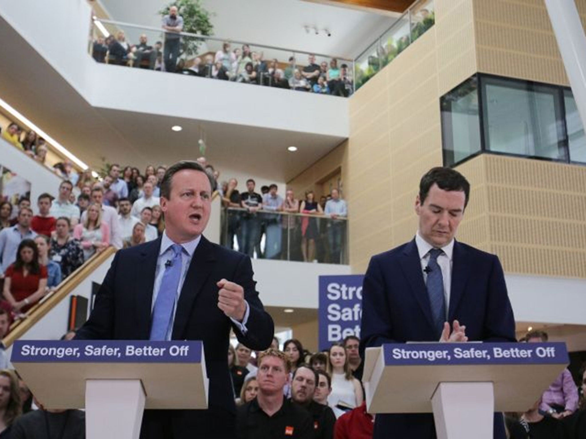 Chancellor George Osborne listens as Prime Minister David Cameron delivers a speech on the economic impact of the UK leaving the European Union at B&Q headquarters in Chandler's Ford, Hampshire, Monday 23 May, 2016