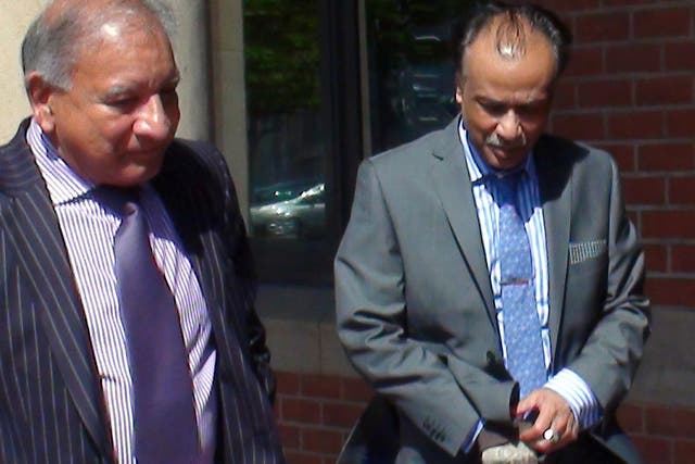 Restaurant owner Mohammed Zaman (right) leaves Teesside Crown Court, he is accused of the manslaughter of a customer who suffered a fatal allergic reaction to peanuts after eating a takeaway curry