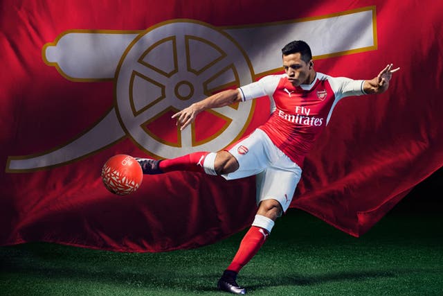 Alexis Sanchez models the new Arsenal shirt