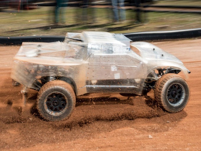 The team's self-driving car makes its way around the track