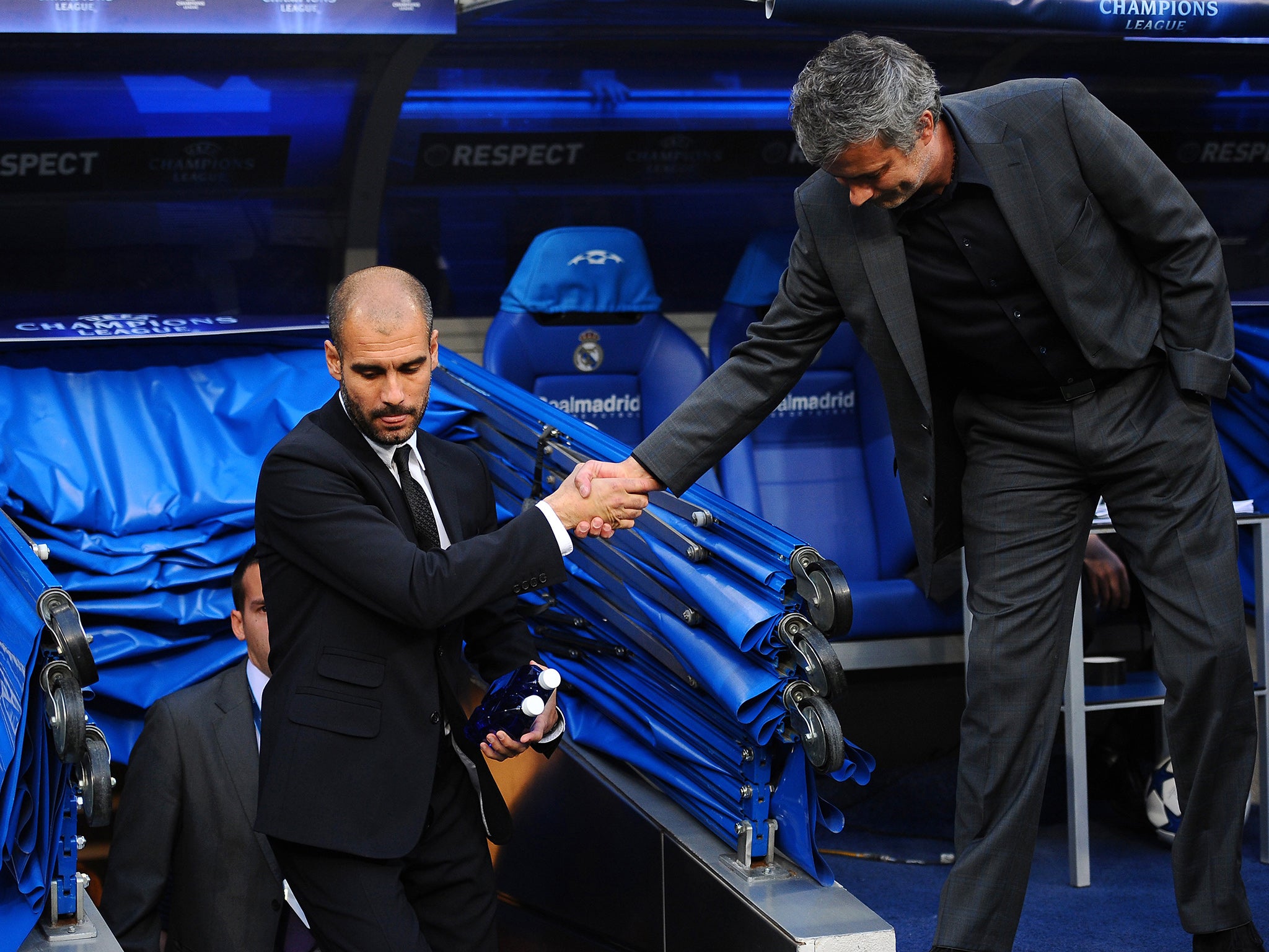 Barcelona's Pep Guardiola and Real's Jose Mourinho shake hands during their at times bitter rivalry in Spain