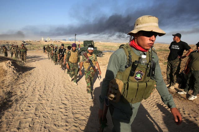 Soldiers advance toward Fallujah, the scene of deadly battles during the US occupation of Iraq