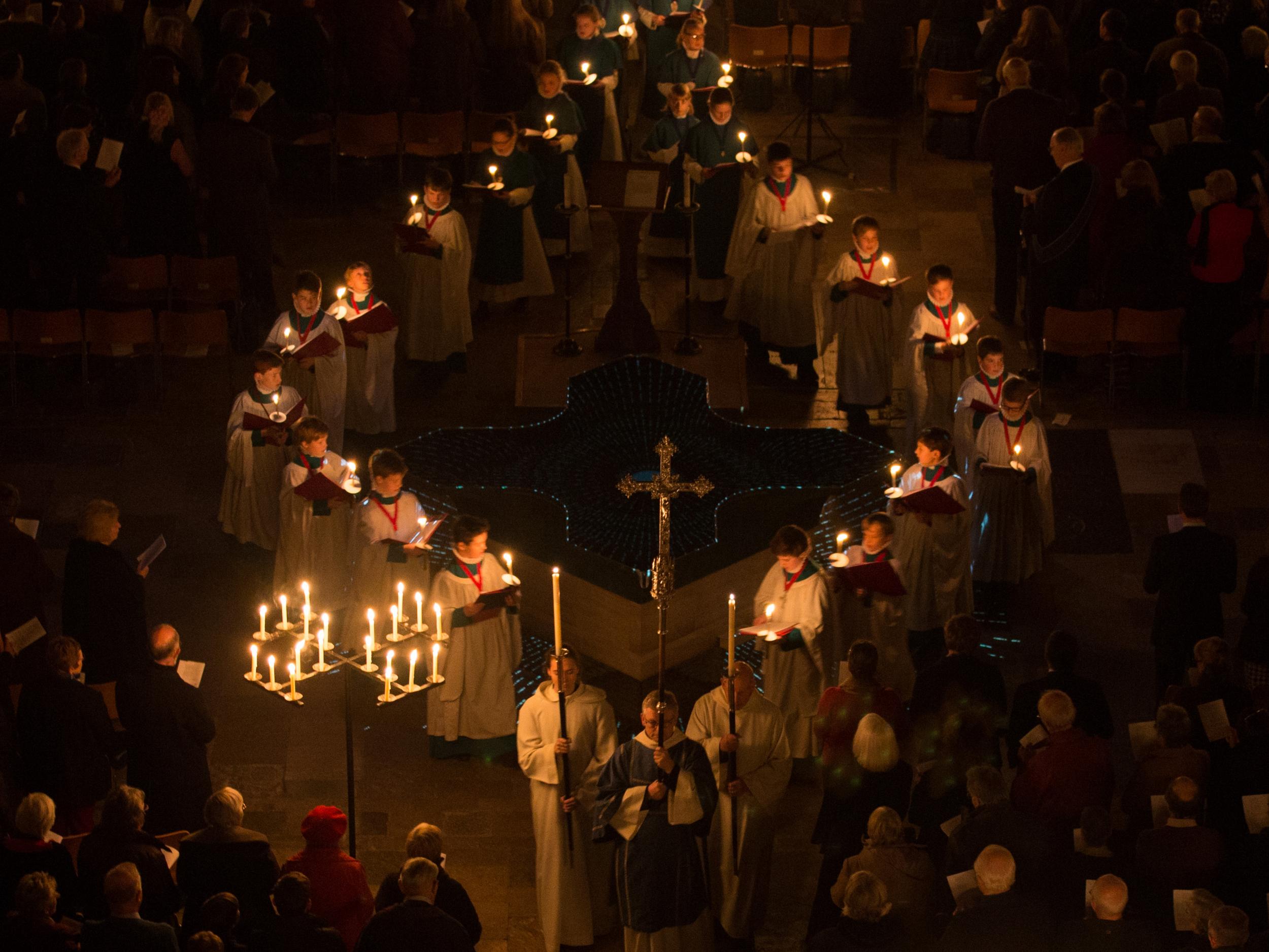 Choristers carry candles during the annual 'darkness to light' advent procession at Salisbury Cathedral