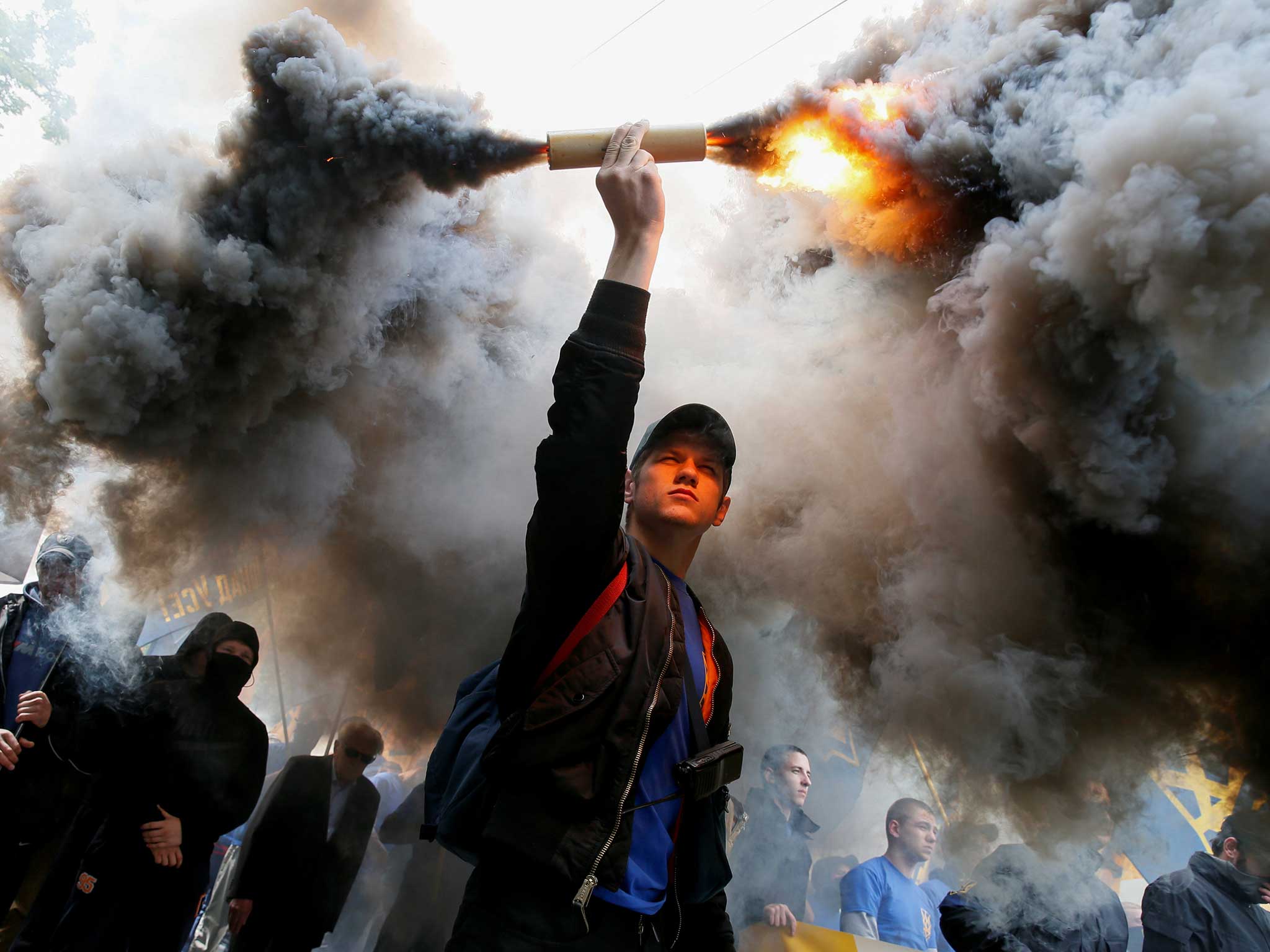 Activists of the Azov civil corp take part in a protest against local elections in pro-Russian rebel-held areas of eastern Ukraine under the Minsk peace agreement, in Kiev