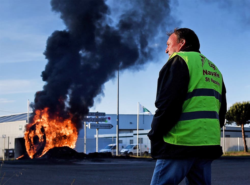 Workers on strike block the access to the harbour of Saint-Nazaire, western France