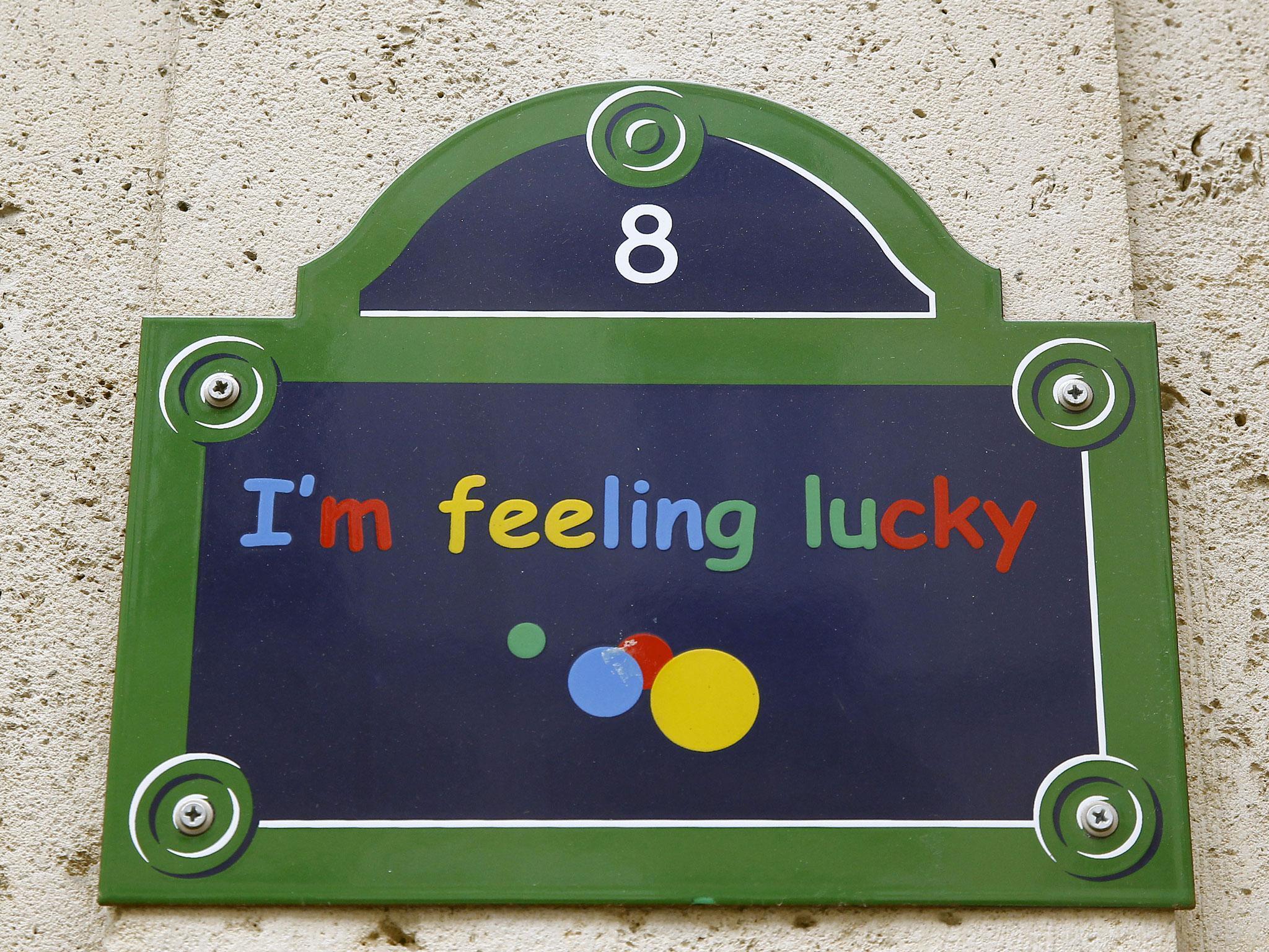The message 'I'm feeling lucky' is seen on the facade of the entrance of Google's Paris headquarters