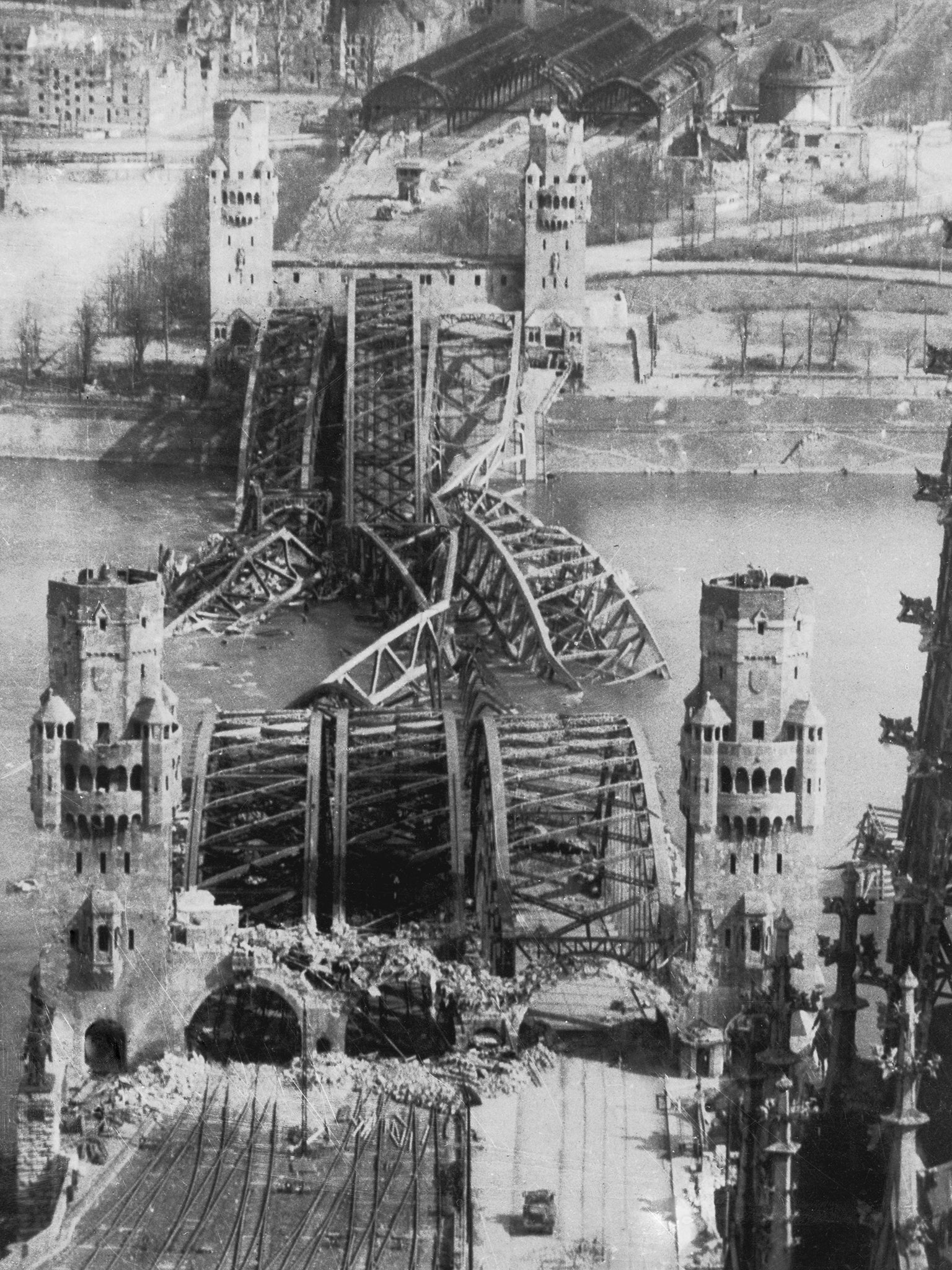 7th April 1945: The Hohenzollern Bridge over the Rhine in Cologne in ruins at the end of World War II. (Photo by Margaret Bourke-White/Keystone/Getty Images)