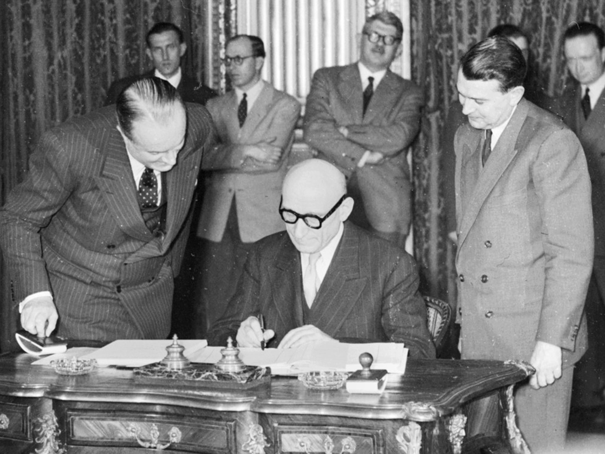 French minister of Foreign affairs Robert Schuman signs the official treaty, 18 April 1951 at the French Foreign office in Paris, of the Schuman Plan which creates the European Coal and Steel Community, France, Germany, Italy and Benelux sharing their mining resources.