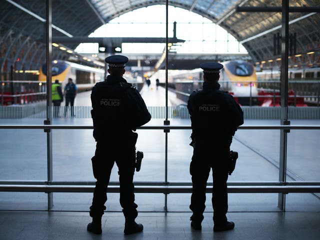 Armed police patrol the Eurostar platforms at St Pancras station