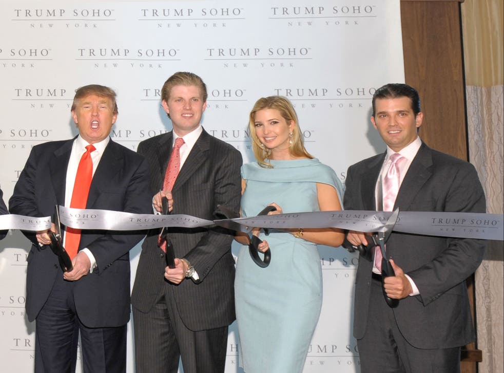 Donald Trump and his children cut the ribbon at the opening of the Trump SoHo building in 2010