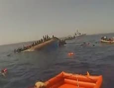 Refugee crisis: Video shows the moment boat carrying asylum seekers capsizes in Mediterranean