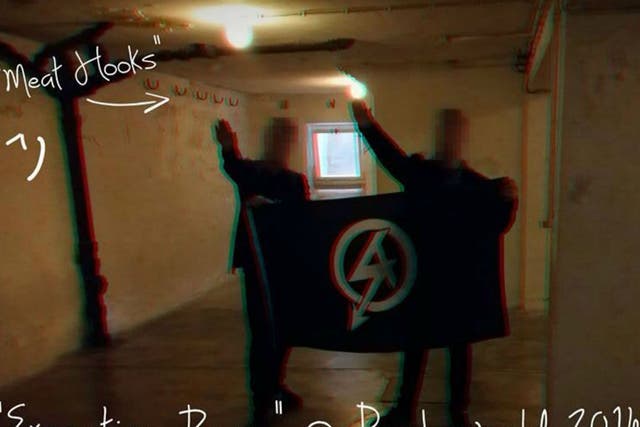 <p>National Action shared a photo of Alex Davies and another member performing Hitler salutes at a Nazi concentration camp</p>