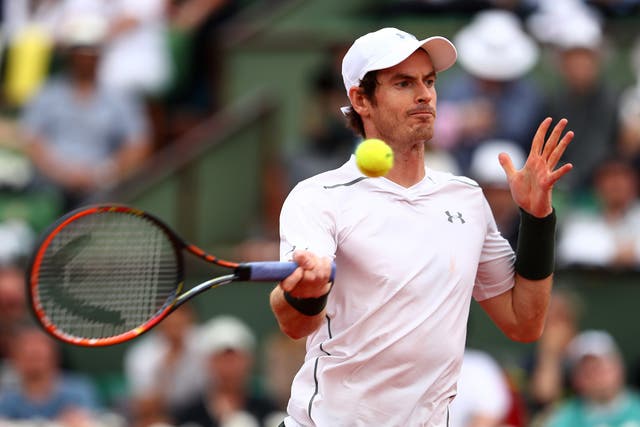 Andy Murray hits a return during his win over Mathias Bourgue