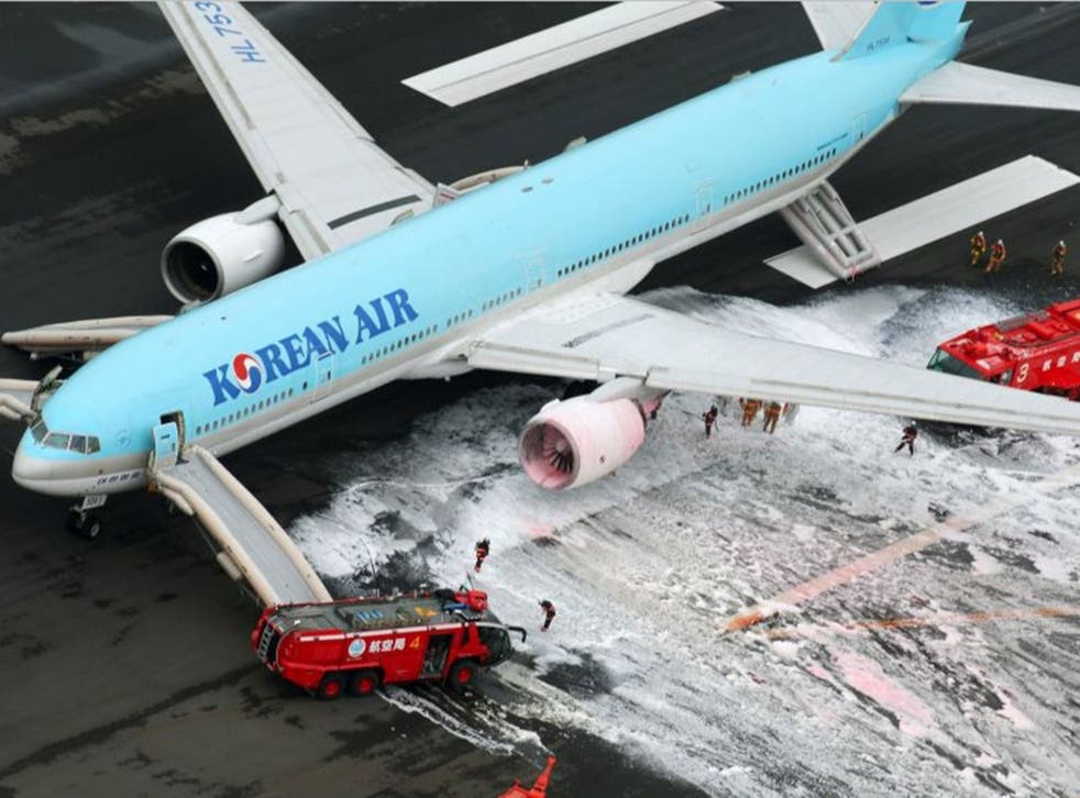 The Korean Air plane was sprayed with foam by firefighters following an engine fire
