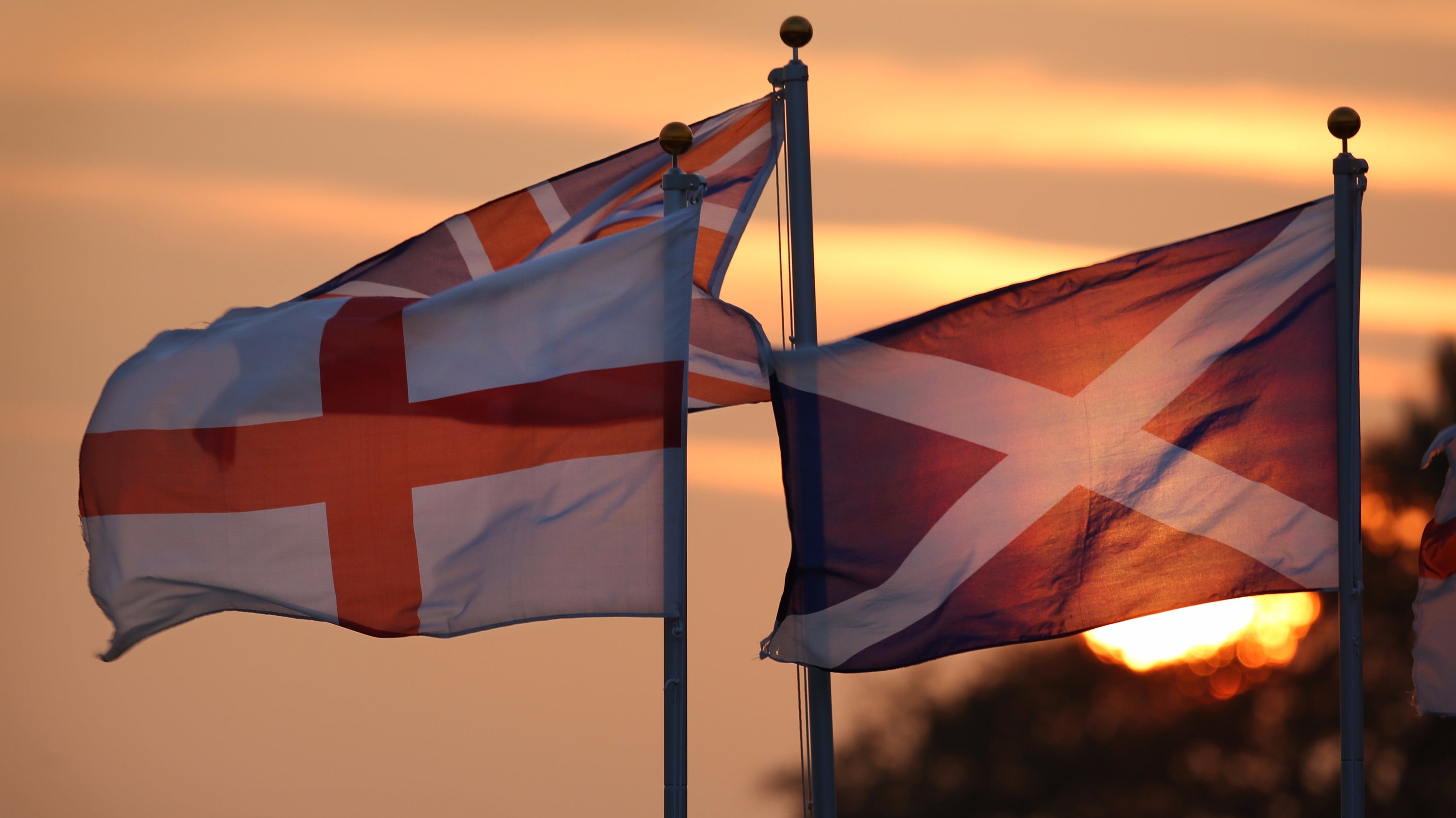 British flags fly at sunset