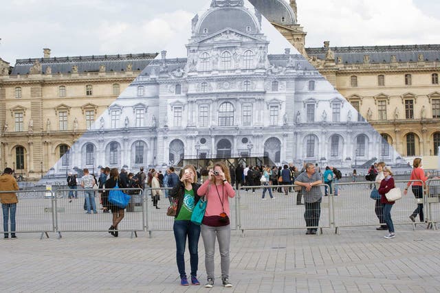 Louvre Museum covered by a JR installation