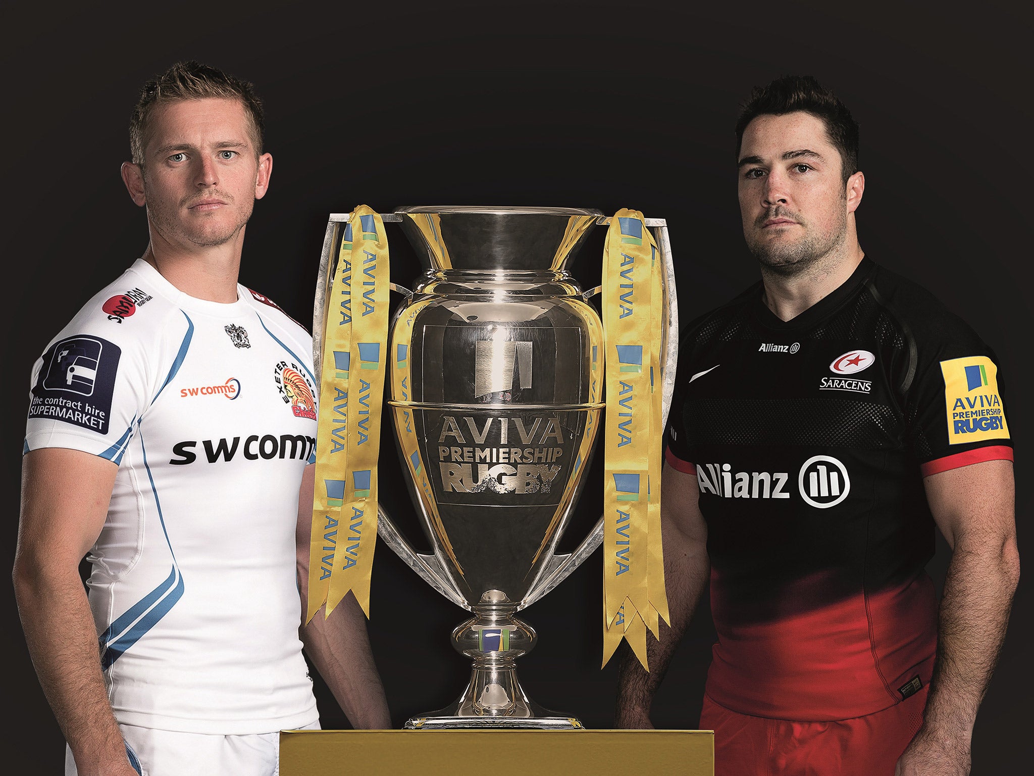 Gareth Steenson of Exeter Chiefs and Saracens captain Brad Barritt pose with the Premiership trophy