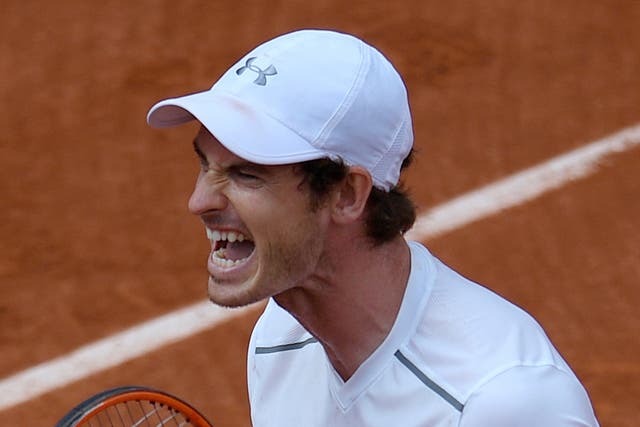 Andy Murray celebrates beating Ivo Karlovic in the French Open third round