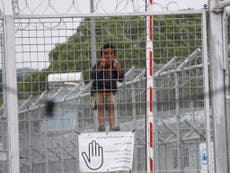 Woman and child killed in fire at refugee detention camp 