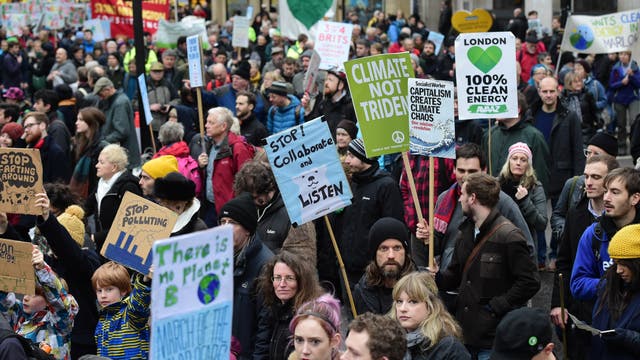 Climate change protests - like this one in London, pictured - have been taking place in cities across the world (LEON NEAL/Getty)