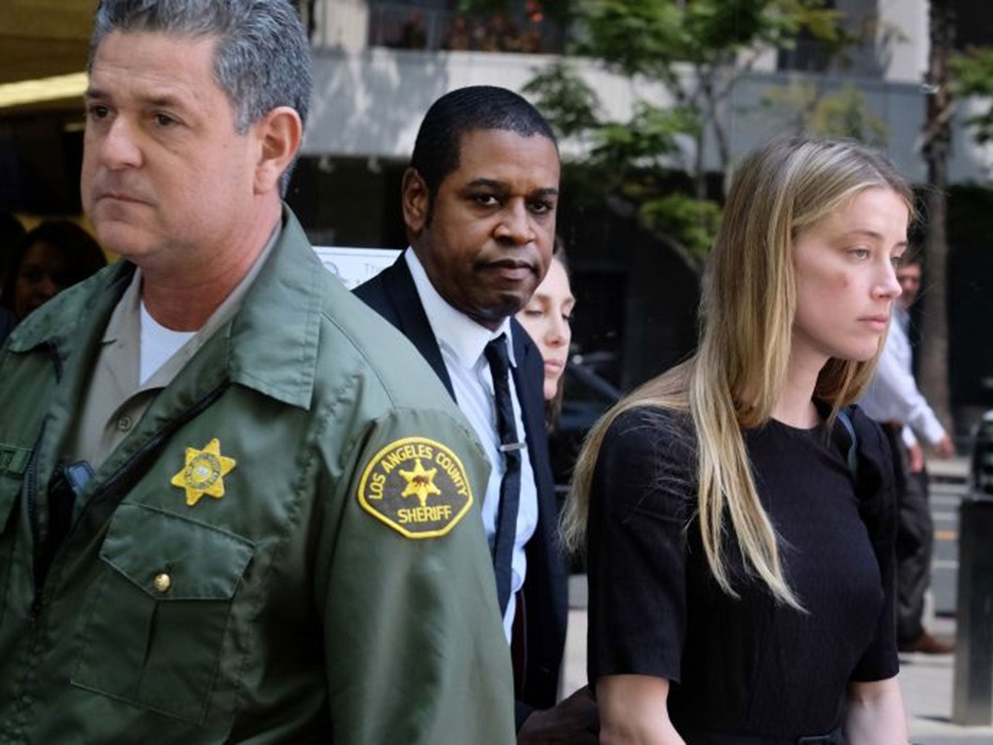 Amber Heard leaves Los Angeles Superior Court court on Friday, 27 May, 2016, after giving a sworn declaration alleging that her husband Johnny Depp threw her phone at her during a fight Saturday, striking her cheek and eye