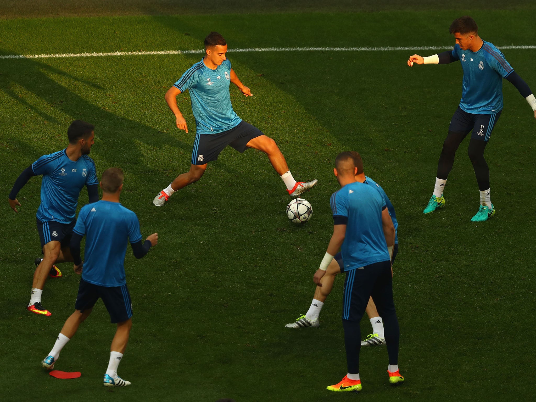 Real Madrid players warming up ahead of the Champions League final at the San Siro stadium in Milan