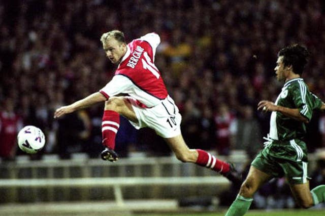 Dennis Bergkamp shoots for goal against Panathinaikos in Arsenal's first Champions League match at the old Wembley in 1998 (Getty)