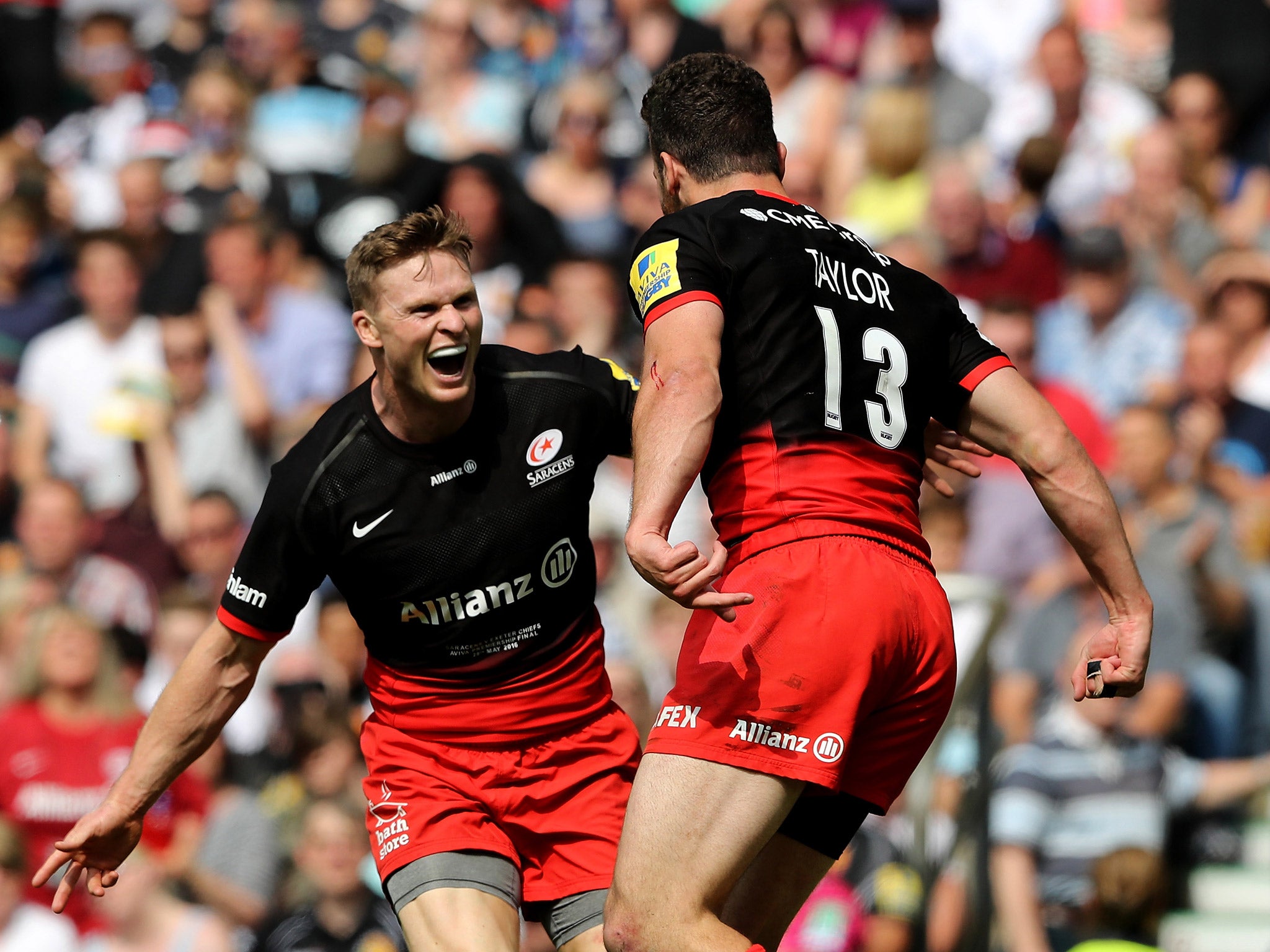 Duncan Taylor celebrates with Chris Ashton after scoring a try for Saracens