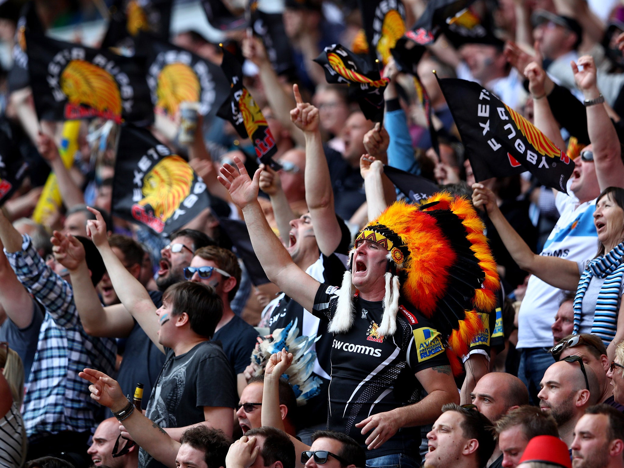 Exeter fans celebrate their side's opening try through Jack Yeandle