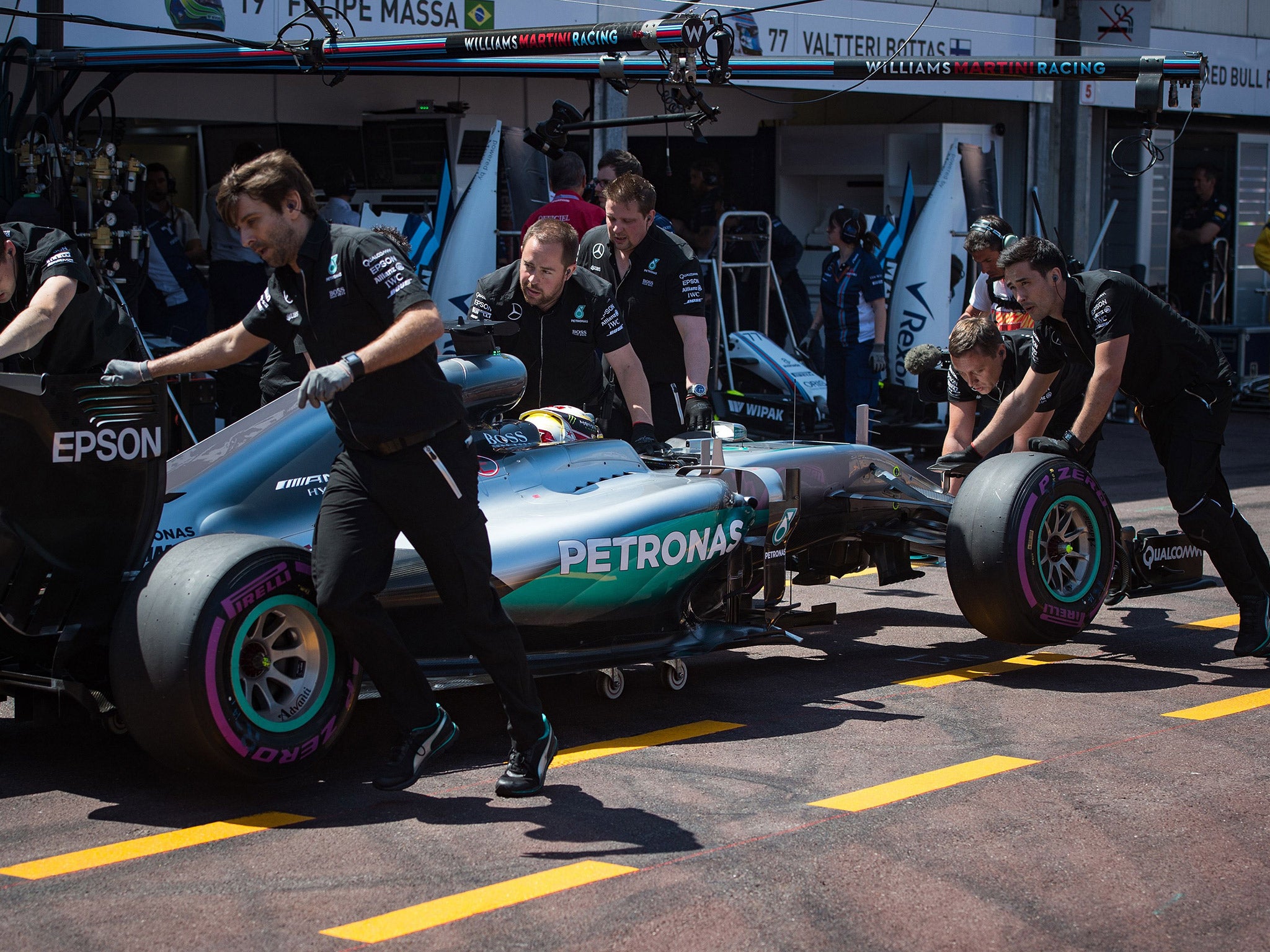 Lewis Hamilton Mercedes is wheeled back into the garage