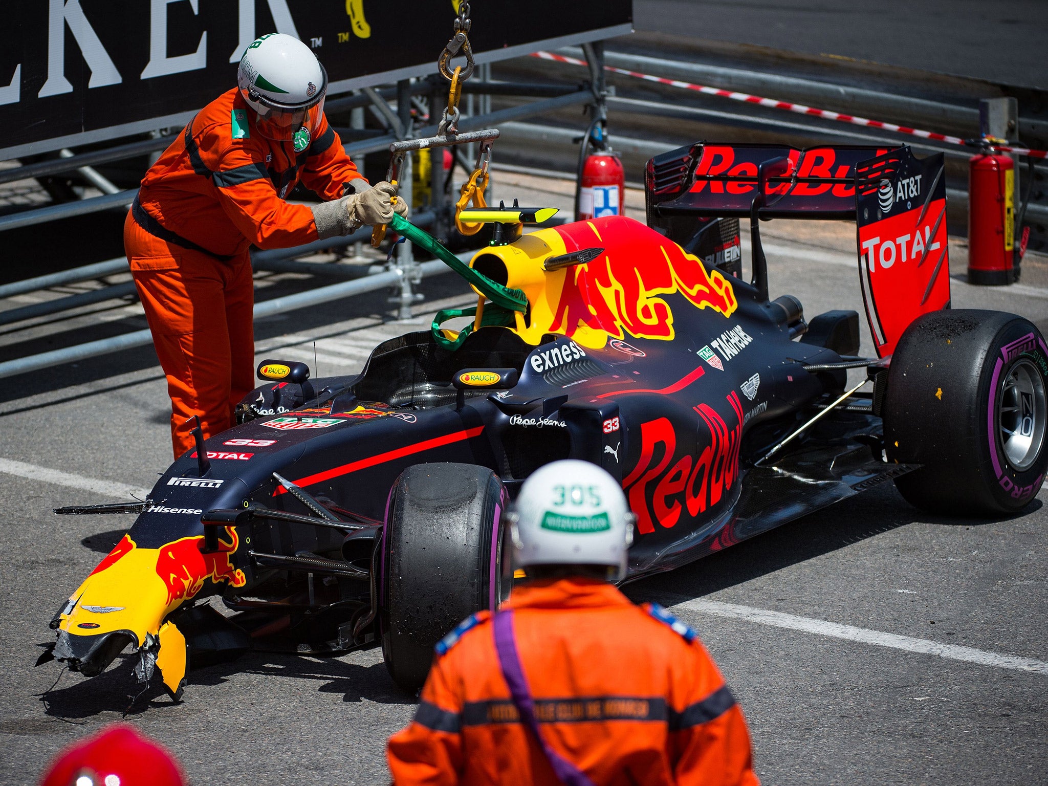 Max Verstappen's damaged Red Bull is left by the side of the track