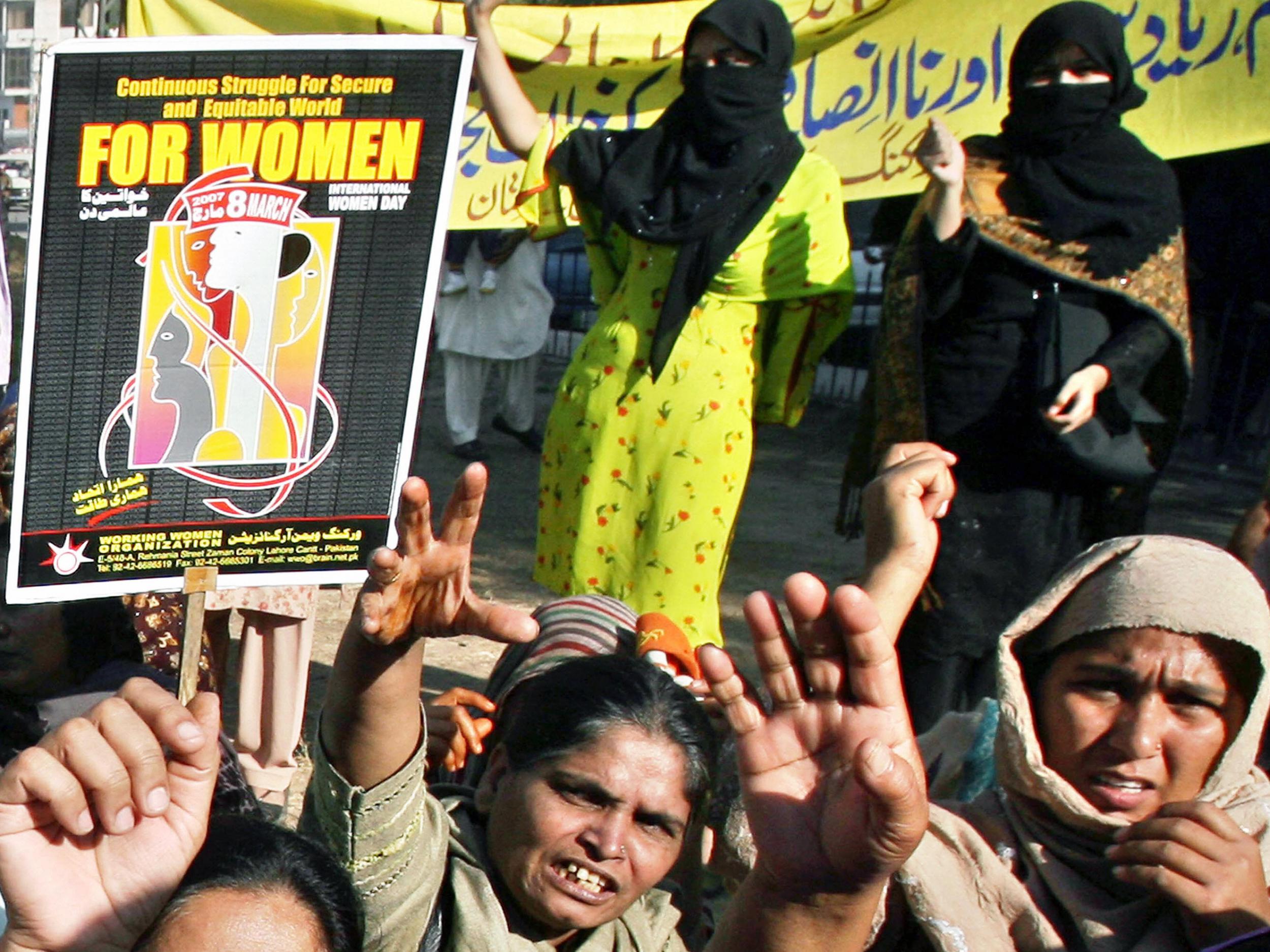 Activists of Pakistan's Working Women Organizations (WWO) chant slogans during a protest ahead of International Women Day
