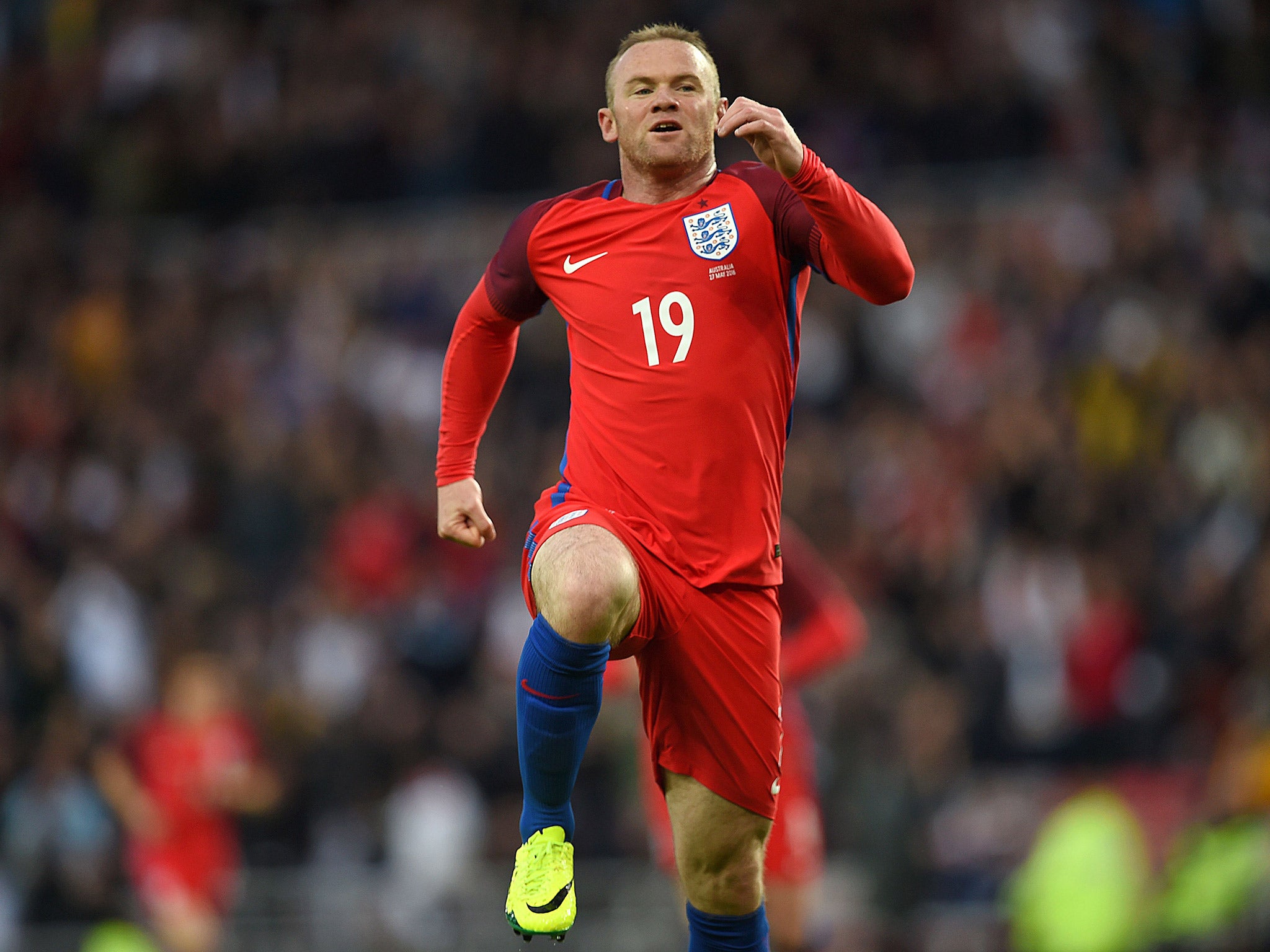 Wayne Rooney leaps in celebration after scoring for England against Australia