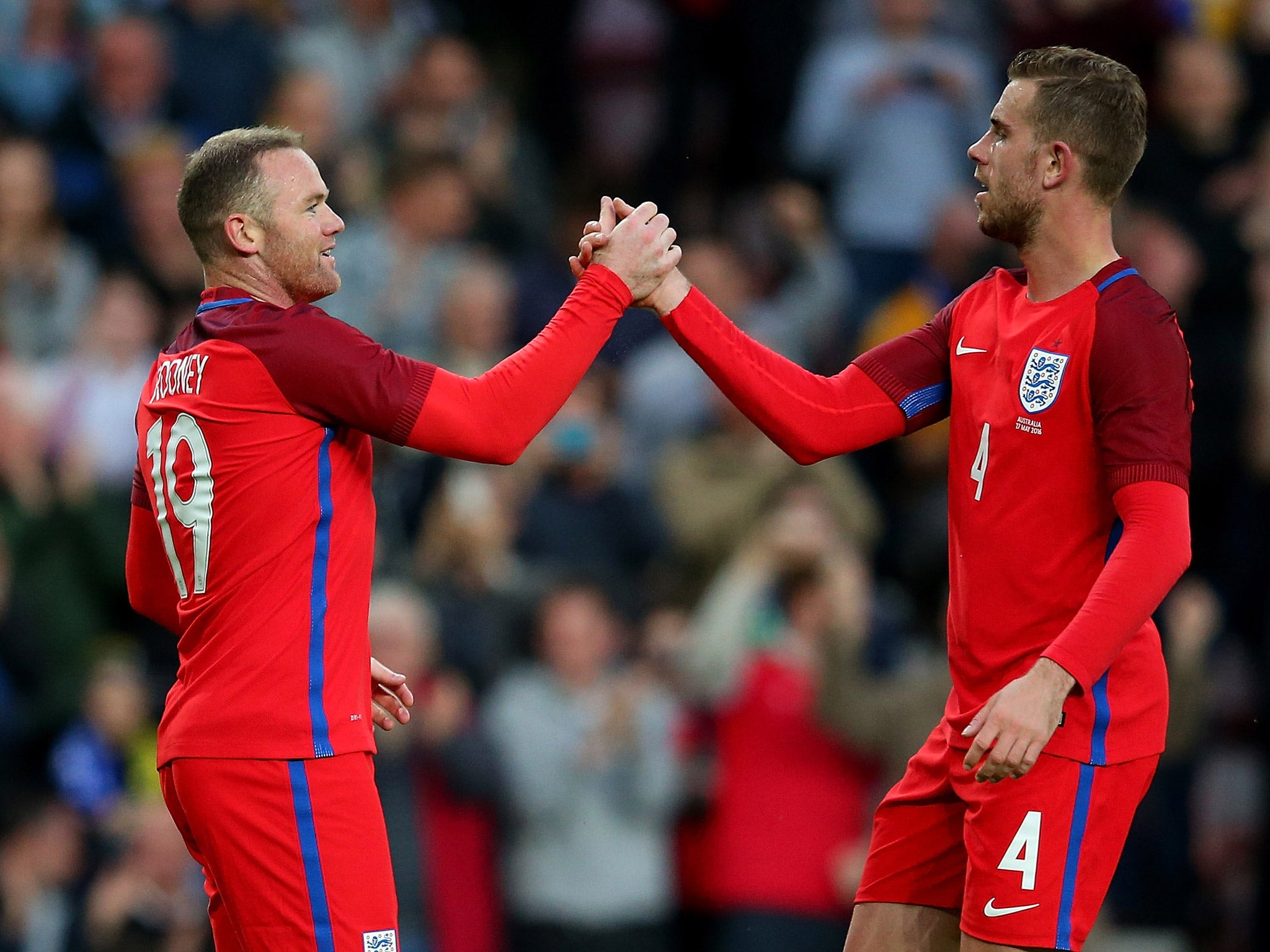 Wayne Rooney celebrates with Jordan Henderson after England's win over Australia