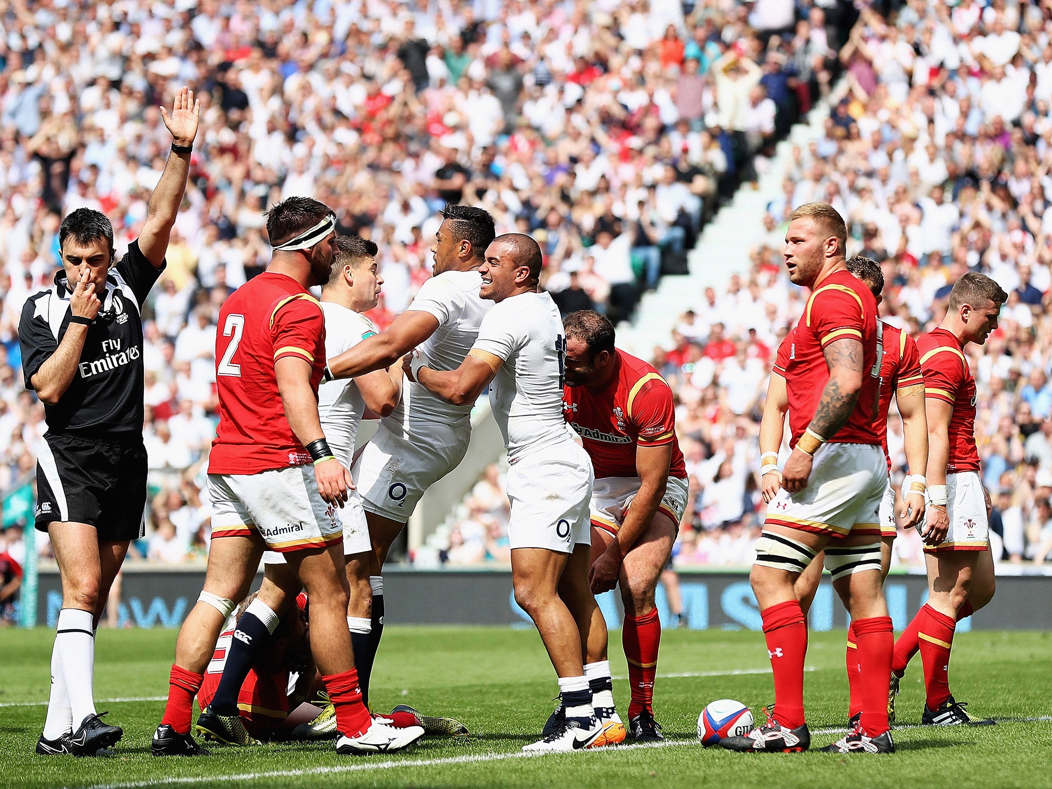 England celebrate after Luther Burrell crashes over for their first try