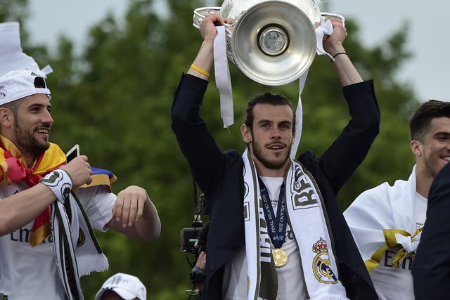 Gareth Bale celebrates with the Champions League trophy
